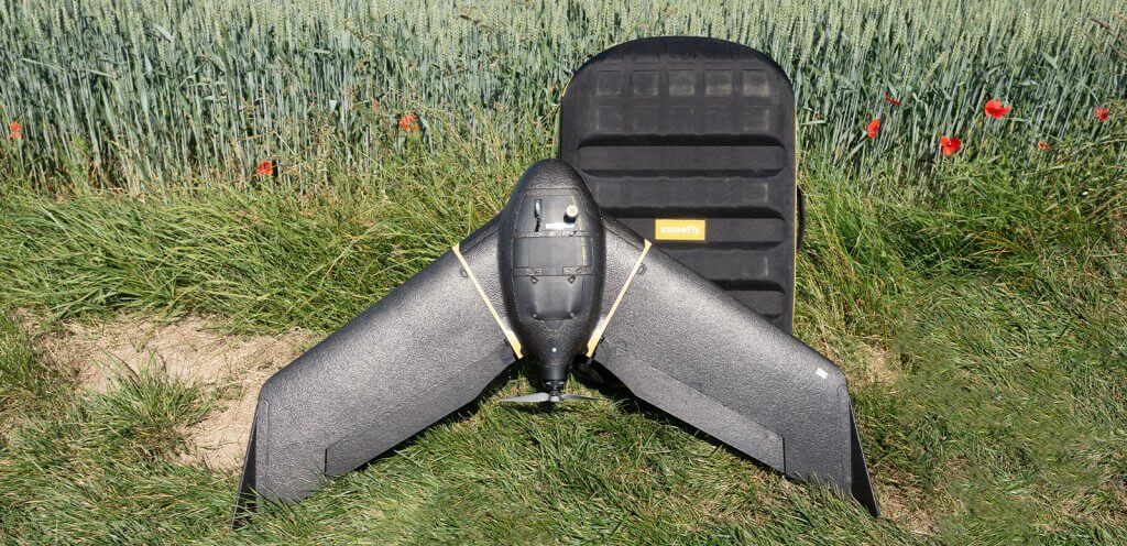 eBee X drone and backpack in a field